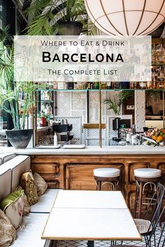 a bar with white tables and chairs in front of it that says where to eat & drink barcelona the complete list