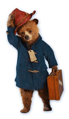 a brown bear wearing a blue coat and hat holding a suitcase in his right hand