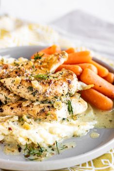 chicken, mashed potatoes and carrots on a plate