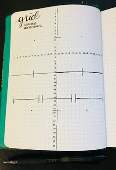 an open notebook with lines drawn on it