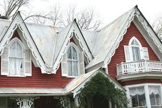 a red house with white trim and windows