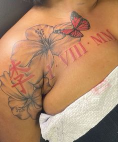 a woman with a butterfly and flower tattoo on her chest