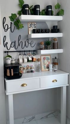 a white desk topped with shelves filled with plants