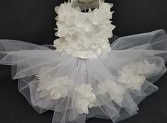 a white tutu skirt with flowers on it