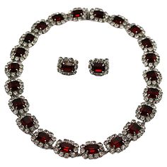 CHRISTIAN DIOR vintage silver tone necklace and clip-on earrings set embellished with rectangular ruby colour crystals adorned with clear crystals. Embossed 1966 CHR. DIOR Germany. NECKLACE Indicative measurements : length approx. 42 cm (16.54 inches) / width approx. 1.3 cm (0.51 inch) Weight approx. 53 grams. EARRINGS Indicative measurements : height approx. 1.5 cm (0.59 inch) / width approx. 1.3 cm (0.51 inch). Weight per earrings : 2 grams. Materials : Silver tone metal hardware / Crystal. NO Dior Vintage, Jewel Necklace, Necklace And Earrings Set, Clear Crystals, Vintage Jewels, Wedding Jewelry Sets, Necklace And Earrings, Color Crystal, Link Necklace