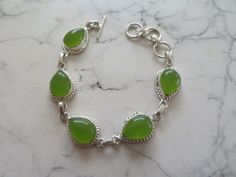 5 Beautiful teardrop shaped Peridot  green gemstones -linked -925 silver bracelet -gift for her -8 inches long - adjustable A PERFECT PLACE TO FIND THAT SOMETHING SPECIAL FOR SOMEONE Merlins Cave, Hippie Bracelets, Peridot Green, 925 Silver Bracelet, Green Gems, Silver Crystal, Green Gemstones, Crystal Gifts, Chain Link Bracelet