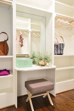 a white dressing table with a mirror, stool and handbag on top of it