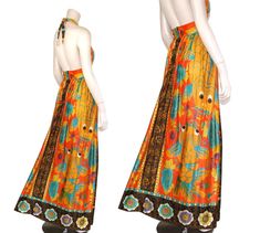 "This 60s or 70-era novelty dress features a stunning orange & black koi print fabric, adjustable halter bodice, fitted waist, and maxi length skirt. The koi fish depicted on this incredible dress are symbols of luck, wealth, and prosperity in many Eastern Asian cultures. Dress has a lined bodice and zips up the back. Best fits size xs or small (please check measurements below). Accessories not included. Payment plans available. Approximate Flat Measurements: Multiply times 2 for bust, waist Fitted Orange Maxi Dress For Beachwear, Orange Retro Maxi Dress For Summer, Retro Orange Maxi Dress For Summer, Orange Retro Summer Maxi Dress, Fitted Maxi Dress With Vibrant Print For Beach Season, Retro Orange Maxi Dress For Beach, Retro Orange Maxi Dress For The Beach, 1970s Style Orange Summer Dress, 1970s Style Summer Floor-length Dresses