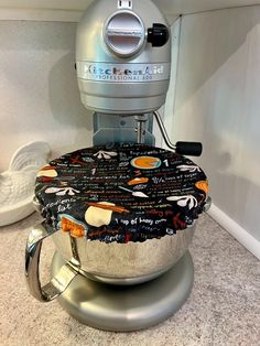 an image of a kitchen mixer that is in the process of being used as a pot holder