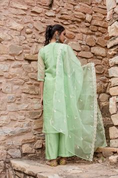 Indulge in opulent luxury with our Mint Green Embroidered Kurta Set. Made with shantoon, this set exudes sophistication and is paired with a Chanderi dupatta for added elegance. Featuring intricate embroidery, this piece celebrates traditional Indian heritage. Elevate your style with this exclusive ensemble. No. of pieces - 3 piece set. Color - Mint Green. Fabric - Shantoon. Washing Instructions - Dry Clean. Festive Pista Green Sets With Intricate Embroidery, Festive Pista Green Set With Intricate Embroidery, Elegant Semi-stitched Tissue Silk Set, Pista Green Chanderi Set With Resham Embroidery, Embroidered Pista Green Palazzo Set For Wedding, Elegant Designer Cotton Silk Sets, Elegant Cotton Silk Designer Sets, Formal Chanderi Palazzo Set With Zari Work, Chanderi Sets With Resham Embroidery