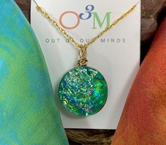 Because the beautiful emerald green colors of this glass remind us of Ireland, we have named this family of colors, "Limerick". This striking, handcrafted, circle dichroic glass pendant is created by combining layers of fusible and dichroic glass which produce a depth and brilliance of color that shifts and blends depending upon your angle of view. The glass is fired in the kiln at temperatures of up to 1800 degrees Fahrenheit and then shaped and ground before going back into the kiln for a fina Artisan Green Recycled Glass Jewelry, Green Glass Jewelry Gift, Green Glass Jewelry As Gift, Green Glass Jewelry As A Gift, Green Recycled Glass Jewelry For Healing, Handmade Green Recycled Glass Jewelry, Handmade Green Jewelry From Recycled Glass, Healing Green Recycled Glass Jewelry, Healing Green Jewelry From Recycled Glass