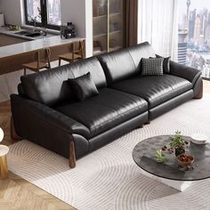 a living room filled with black leather furniture