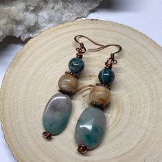 Handcrafted By Blue Moon Jewelry These Three Stone Earrings Are Made With Indian Jasper, Carnelian And Chrysoprase Gemstones Wire Wrapped In Copper Wire. Please Note The Stones Are Not An Exact Match. Will Come In An Organza Jewelry Bag. Semi Precious Stone Earrings Handmade, Handmade Spiritual Jade Earrings, Agate Earrings With Natural Stones In Round Beads Shape, Agate Gemstone Bead Dangle Earrings, Dangle Earrings With Amazonite And Natural Stones, Handmade Agate Round Bead Earrings, Amazonite Natural Stone Earrings For Gifts, Aventurine Natural Stone Earrings Gift, Aventurine Natural Stone Earrings