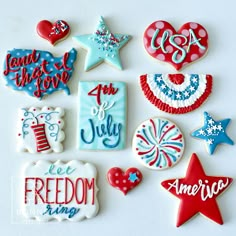 decorated cookies are displayed on a white surface