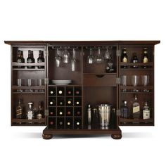 a wooden cabinet filled with lots of bottles and glasses