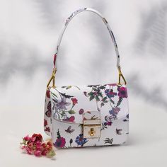 Nwot Genuine Leather Made In Italy Primavera Floral Handbag Our Primavera Handbag Is The Perfect Example Of What Can Happen When Each Of The Four Elements Of Handbag Mastery Is Executed Flawlessly. The Primavera Is Crafted From Gorgeous Italian Leather, In A Whimsical Floral Pattern That Recalls The Intoxicating First Days Of Spring. Proportion, Line, Material And Finish-The Primavera Is The Full Package! Specifications Made In Italy 81/2" X 41/2" X 6 1/2" 100% Calf Leather Floral Printed Oneint White Tote Shoulder Bag With Single Strap, White Satchel Tote With Single Shoulder Strap, White Satchel With Single Shoulder Strap Tote Shape, Chic White Satchel With Single Shoulder Strap, White Rectangular Bag With Gold-tone Hardware, White Chic Satchel With Single Shoulder Strap, White Square Box Bag With Gold-tone Hardware, Luxury White Flap Bag With Removable Pouch, White Satchel Evening Bag