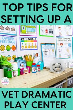 a desk with books, pencils and papers on it in front of a bulletin board that says vet dramatic play center