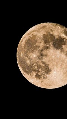 an airplane flying in the sky with a full moon on it's back side