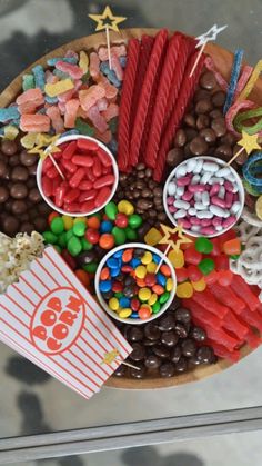 a wooden plate topped with lots of candy and candies