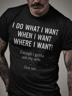 a man wearing a black t - shirt that says i do what i want when i want where i want