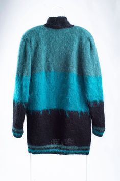 "SIZE: intended to fit size L, but may be worn by even smaller (M) and larger (XL) frames for a desired fit. MATERIAL: 75% mohair, 25% acrylic. COLOR: teal blue, green, black. FEATURES: this vintage woman's open front mohair blend cardigan is intended for an oversized fit, has padded shoulders (can be easily removed if not needed) and is fully lined what adds some windproofness. Wear open front or belted with matching belt and it will definitely make you stand out of the crowd. CONDITION: excell Green Mohair Winter Cardigan, Mohair Cardigan, Black Features, Mohair Wool, Shearling Jacket, Teal Blue, Cardigans For Women, Front Open, Color Blocking