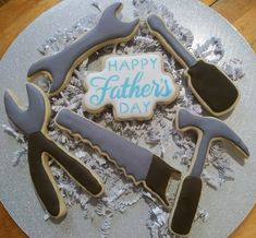 a decorated fathers day cookie with tools on it