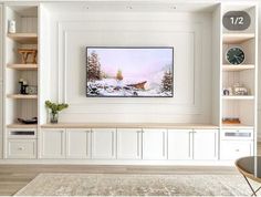 a living room filled with furniture and a painting on the wall