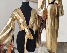 two mannequins dressed in shiny gold clothing