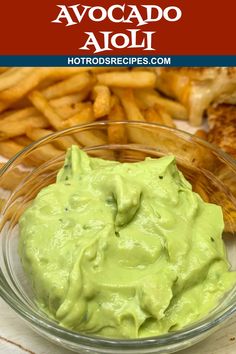 avocado dip in a glass bowl with french fries on the side and text overlay