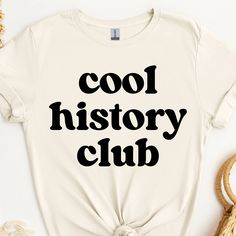 This history shirt makes a totally unique history gift for history teachers and professors, especially during Teacher Appreciation Week and more! Grab this tee today while it's on sale! Delivery Times: ◦ Production: 1 business day on average (maximum: 5) ◦ Shipping: 2 business days on average (maximum: 5) Unisex Fit: ◦ Extra soft, preshrunk unisex t-shirt ◦ Women: Semi-fitted, laidback, rollable, & tuckable ◦ Men: Fitted on upper body & loose around the belly ☞ Size up for a looser fit Soft Materials: ◦ Super soft, preshrunk tee with eco-friendly materials ◦ Black, White, & Navy: 100% soft ring spun cotton ◦ Heather Navy: 65% polyester & 35% cotton ◦ Sport Grey: 90% cotton & 10% polyester History Teacher Shirt, History Teacher Gifts, Funny History, Gifts For History Buffs, History Teacher, History Humor, History Teachers, Teacher Appreciation Week, Gift Teacher