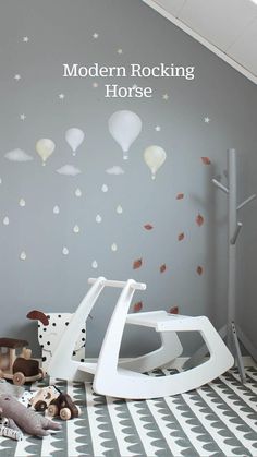 a child's room with balloons and stars on the wall