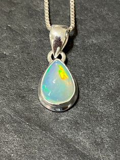 * Ethiopian Opal Teardrop Pendant *Sterling Silver  *Free Shipping  *Handcrafted  *Jewelry ship in Gift box  *Genuine Ethiopian Opal All components are solid .925 silver.  Thank You For Your Looking ,And Check Out More Items In My Etsy Shop For More Great Deals, Also We Add More Jewelry To Etsy Shop regularly  www.etsy.com/shop/Silverlizzard  PLEASE check their dimensions, before setting the order.  NOTE -Once the parcel gets shipped out, it is usually needed 3-6 business days for every where in Luxury Ethiopian Opal Teardrop Jewelry, Costumes Diy, Teardrop Pendant, Gem Stones, Opal Pendants, Fabulous Fashion, Cute Jewelry, Ethiopian Opal, Pendant Necklaces