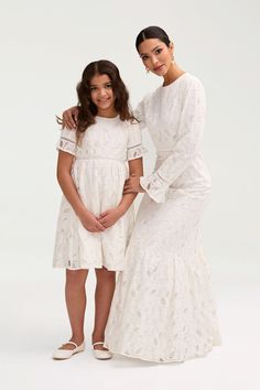 Embrace elegance with our Rayaa White Lace Dress, crafted with delicate lace and designed to match mommy's style. Make a statement at any special occasion with this exclusive piece. Model is 8 years old and 54 in. tall wearing size 8Y-9Y. White Scalloped Lace Fitted Baptism Dress, White Floor-length Scalloped Lace Dress, Off-white Lace Dress For Baptism, White Lace Maternity Dress With Lace Trim, White Maxi Dress With Scalloped Lace V-neck, Dresses Flowy, White Dress Formal, Nikkah Dress, Engagement Dresses