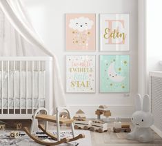 a baby's room with posters on the wall