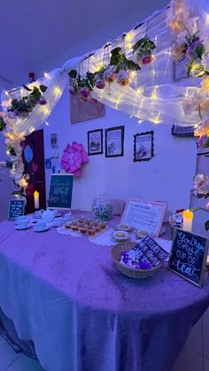 the table is covered with flowers and cards