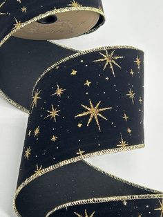 a black ribbon with gold stars on it