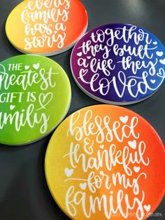 four painted coasters with the words'the greatest gift is family '