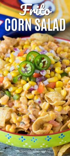 mexican corn salad in a bowl with tortilla chips and jalapenos