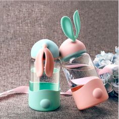 a glass jar with some bunny ears in it