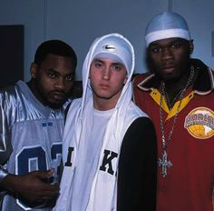 three young men standing next to each other