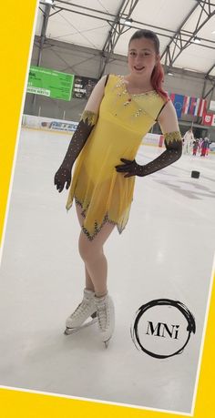 a woman in a yellow dress is skating on an ice rink with her arms behind her back