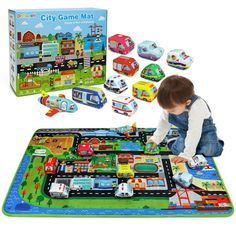 a child playing with a city game mat