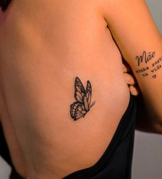 a woman with a butterfly tattoo on her left side ribcage and the word mia written in cursive writing