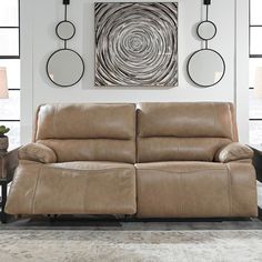 a living room scene with focus on the reclining sofa