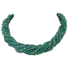 A Genuine & Natural Emerald Faceted with Gold Beads Choker Necklace consisting of 15 lines weighing 540 carats with an 18K Yellow Gold Clasp. The length is 17.50" and the beads range from 2.50MM to 6MM. We can also customize the necklace according to your preferences, as per the number of strands, the size of the beads, the weight, etc. Please contact us for more information. Emerald Beads Necklace, Emerald Choker, Delicate Diamond Necklace, Beads Choker Necklace, Necklaces Beaded, Beads Choker, Faceted Bead Necklace, Vintage Beads Necklace, Emerald Bead