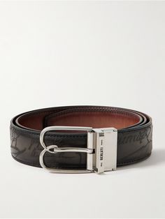 Berluti's 'B Volute' belt is reversible, so you can choose between its signature 'Scritto' design or the smooth plain side. It's crafted from black and tonal-brown Venezia leather with a polished silver-tone 'B' buckle and logo-engraved fixed metal loop. Designer Formal Belts With Engraved Logo, Designer Belts With Engraved Logo For Formal Occasions, Designer Leather Belts With Engraved Logo, Luxury Leather Belt With Engraved Logo, Luxury Leather Belts With Engraved Logo, Black Leather Belt With Engraved Logo, Black Leather Belts With Engraved Logo, Classic Formal Belt With Engraved Logo, Formal Leather Belt With Engraved Logo