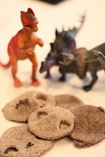 small toy dinosaurs and other toys on a table