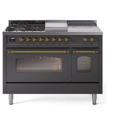 an old fashioned stove with two ovens on it's sides and gold knobs