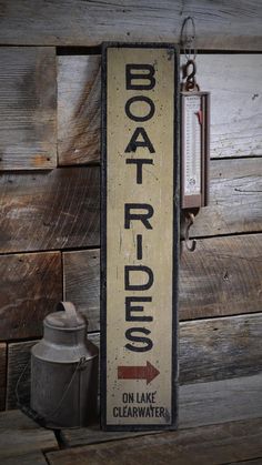 a sign on the side of a wooden wall