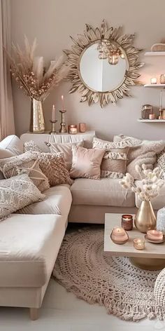 a living room filled with lots of furniture and decor on top of a white rug